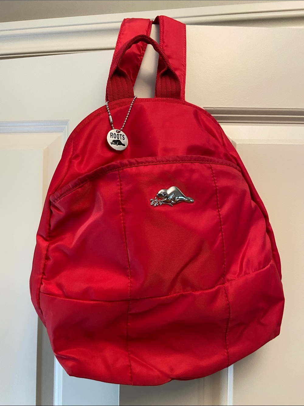 Roots Red Women's Backpack with Silver Beaver Emblem